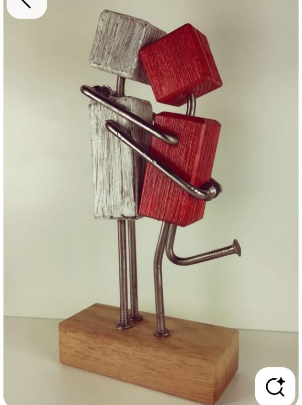 Romantic couple hugging sculpture made of wood and metal – handmade love showpiece